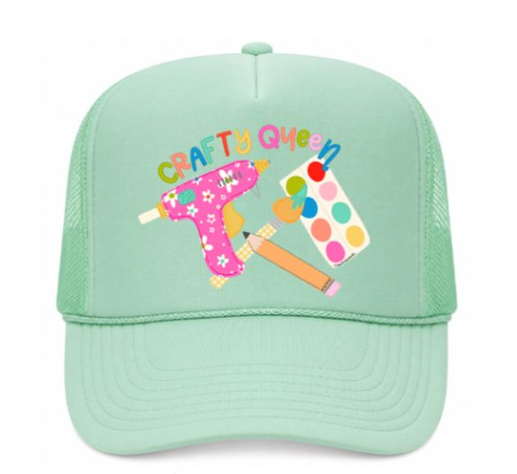 Mint green cap with 'Crafty Queen' text and craft-themed graphics on a white background