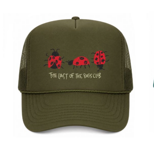 Green cap with ladybug design and text on a white background