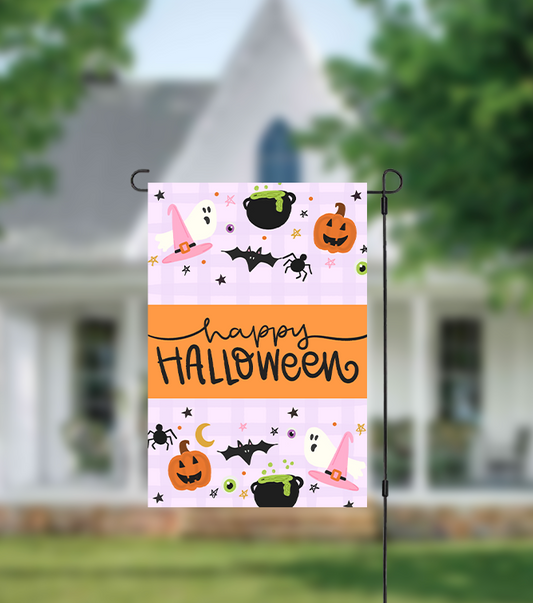 Halloween-themed garden flag with pumpkins, witches' hats, and bats on a house background.