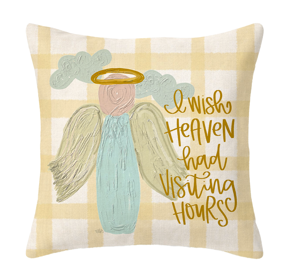 Decorative pillow with angel illustration and text on a checkered background