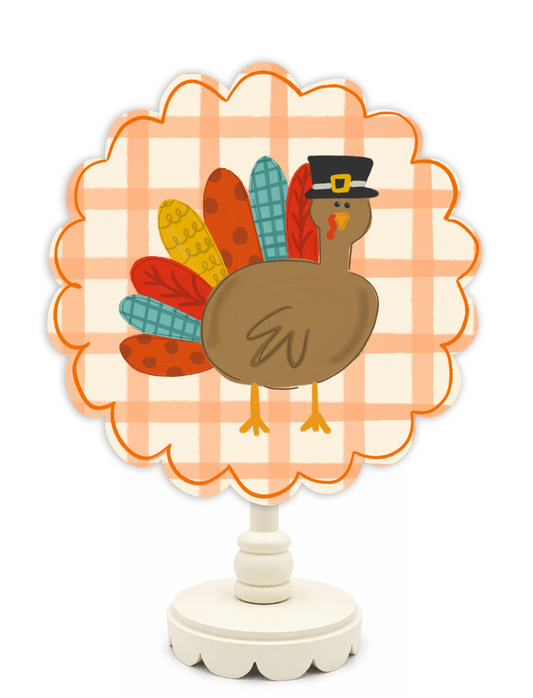Decorative Thanksgiving turkey with plaid background on a white stand