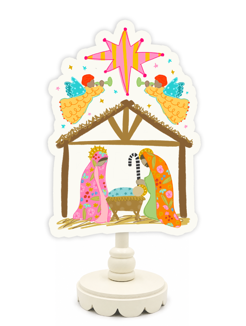 Decorative nativity scene with colorful figures and a star on a white background