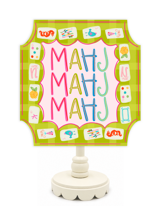 Decorative sign with colorful letters 'MAHJ' on a green background