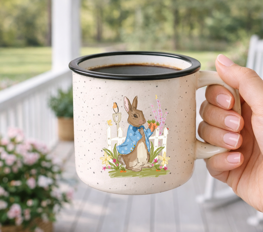 Doodles by Rebekah "Peter Rabbit" campfire mug featuring a whimsical hand-painted bunny illustration. This charming ceramic coffee cup is a perfect gift for Easter, spring tea parties, or as a nostalgic addition to a farmhouse-style kitchen.