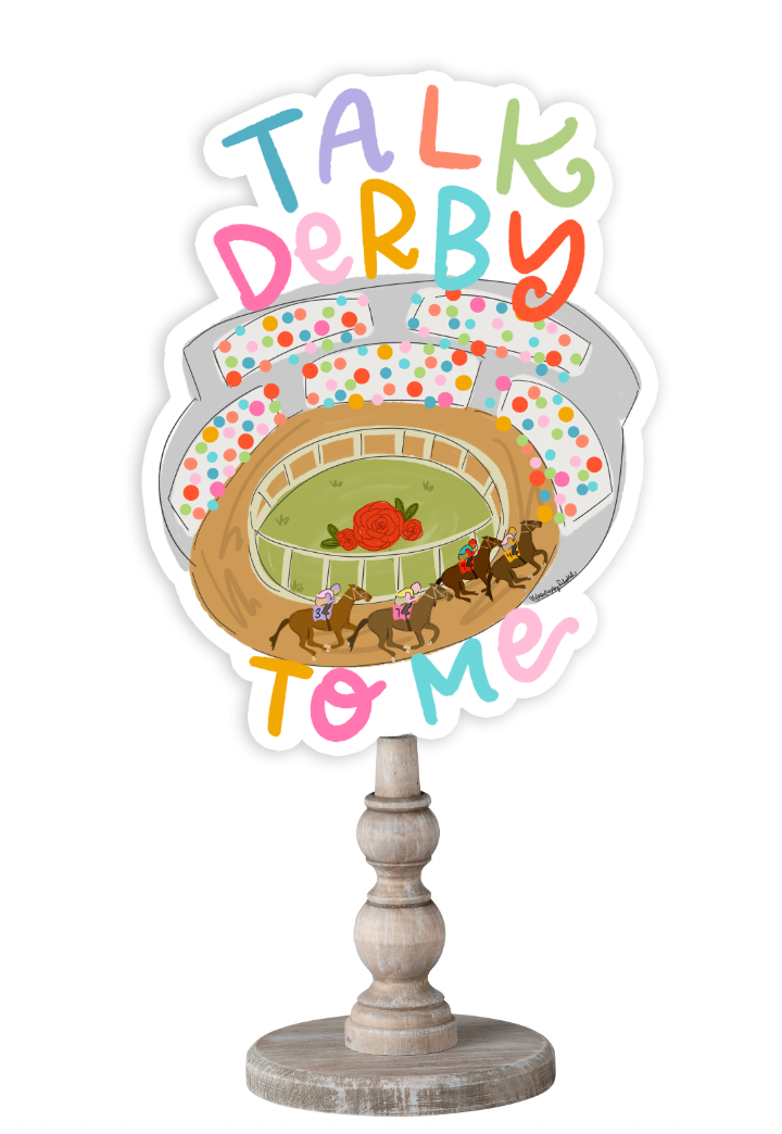 Doodles by Rebekah horse racing decor featuring a whimsical racetrack illustration and "Talk Derby To Me" hand-lettering on a rustic turned wood stand.