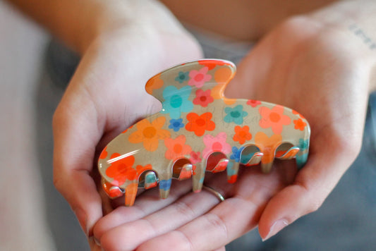 Patterned matte hair claw clip for women with colorful floral illustrations, perfect for stylish hair accessorizing.