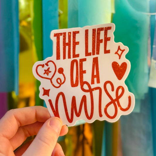Doodles by Rebekah "The Life of a Nurse" burnt orange glitter sticker. This hand-painted medical-themed vinyl decal is a perfect gift for nursing students, RNs, and healthcare workers to decorate water bottles, clipboards, and planners.