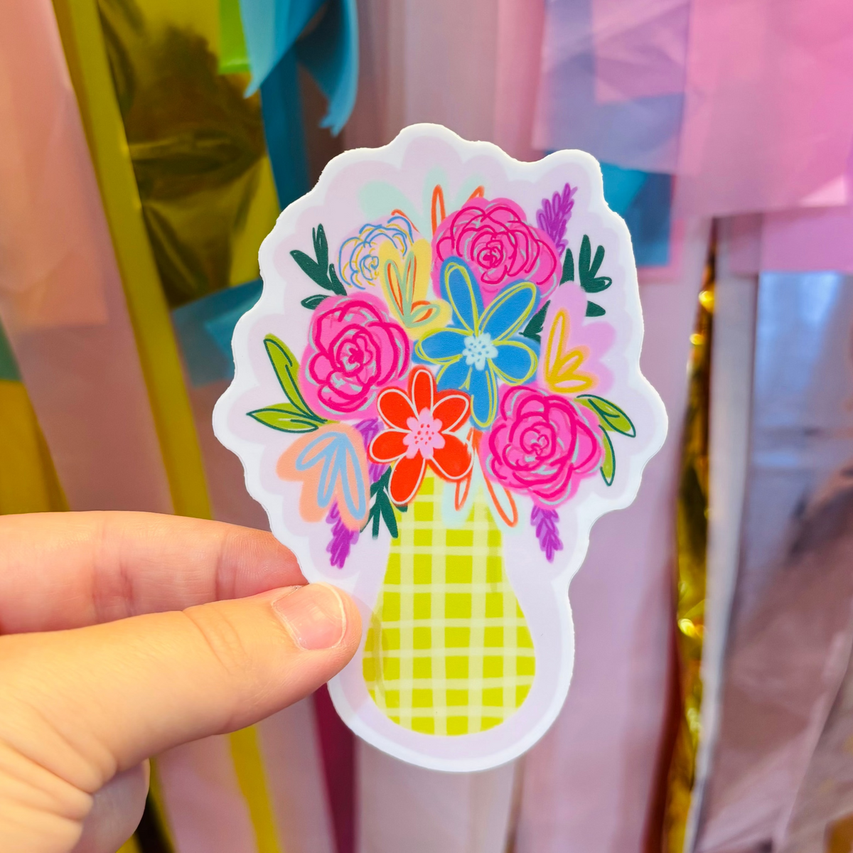 A hand holding a Yellow Gingham Flower Vase Sticker
