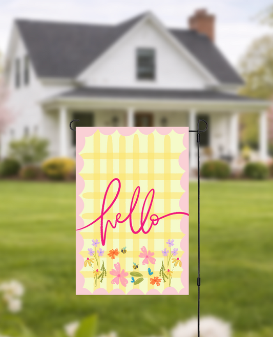Doodles by Rebekah "Hello" floral garden flag featuring whimsical hand-painted typography and a yellow checkered pattern. This vibrant outdoor seasonal decor is perfect for welcoming guests to a front yard, garden, or porch.