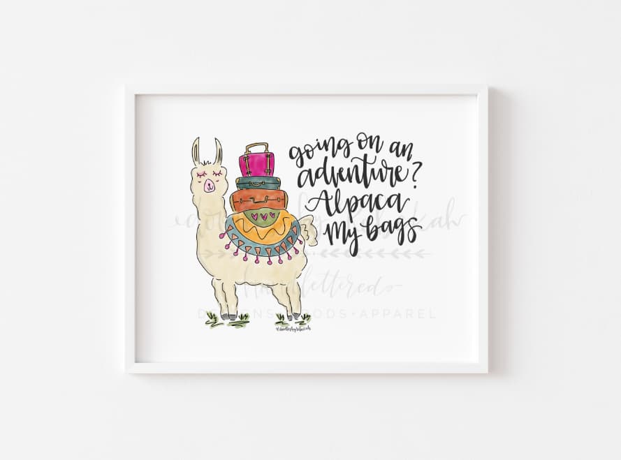 a white wall with a print of an alpaca and the words "going on an adventure? Alpaca my bags."