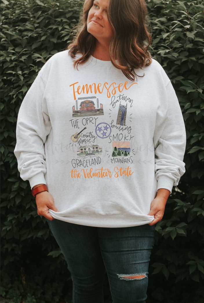 Woman wearing a white shirt with doodles of Tennessee