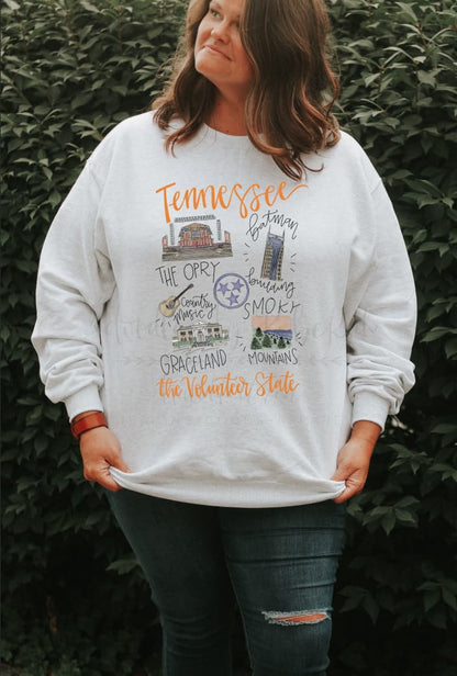 Woman wearing a white shirt with doodles of Tennessee