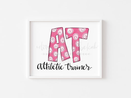 An 8x10 print of the phrase 'Athletic Trainer' with a stylized 'AT' in pink, on a white background with a pink border.