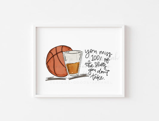 White framed print with image of basketball and a shot glass 