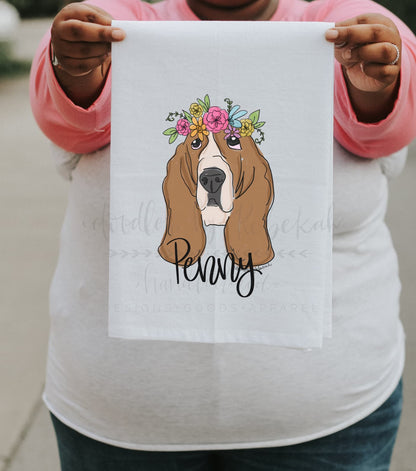 Person holding a personalized tea towel of a basset hound 