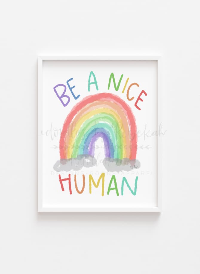 An 8x10 framable print featuring a colorful hand-drawn rainbow with the text 'BE A NICE HUMAN' in bold letters, on a white background.