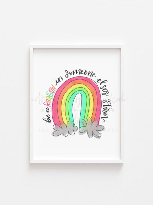Framed drawing with a doodle of "be a rainbow in someone else's storm"