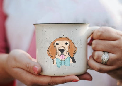 Person holding a coffee mug with a graphic of a male beagle wearing a blue bowtie