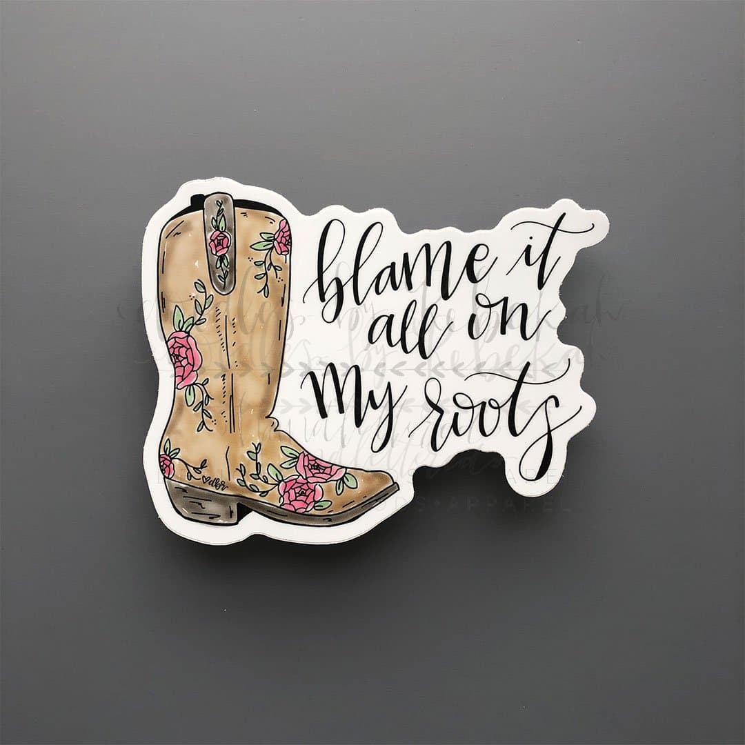 "Blame it all on my roots" sticker with a stylized cowgirl boot