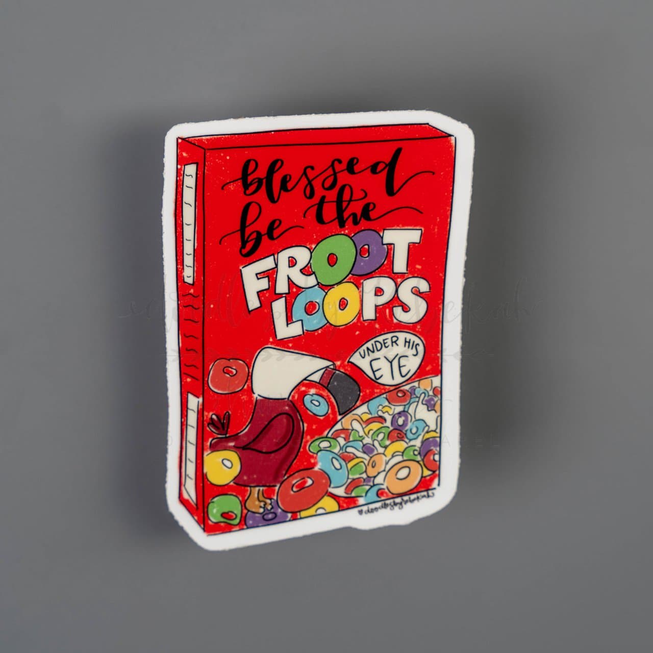 Handmaid's tale inspired "Blessed Be the Froot Loops" sticker on a grey background