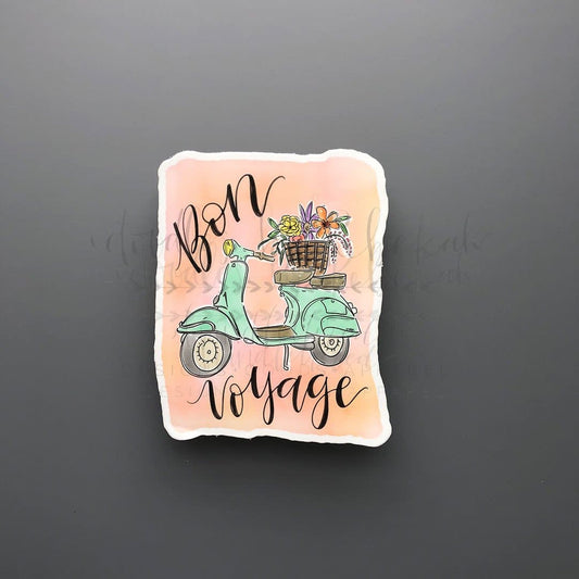 A sticker with a cartoon scooter and the text 'Bon Voyage' on a pink background.