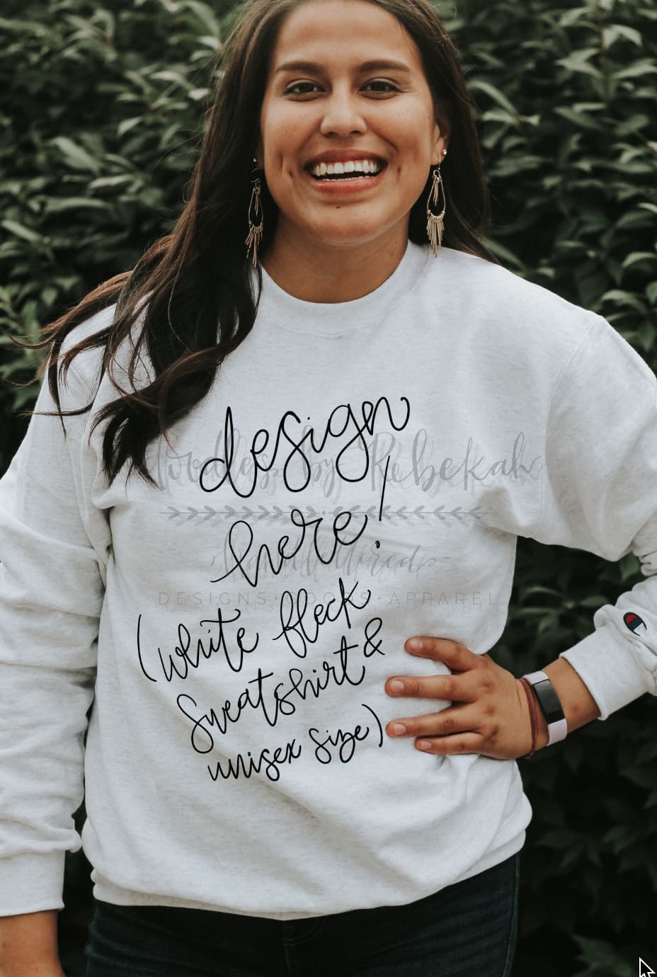 a woman wearing a white sweatshirt with the text "Design Here!" showing it can be customized