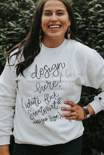 a woman wearing a white sweatshirt with the text "Design Here!" showing it can be customized